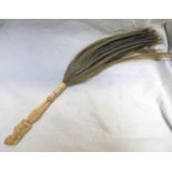 19TH CENTURY IVORY HANDLED FLY WHISK, THE HANDLE CARVED IN THE FORM OF A DEITY,