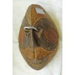 IGBO MASK WITH NARROW FOREHEAD AND CARVED CIRCLES AROUND EYES WITH POLYCHROME DECORATION,