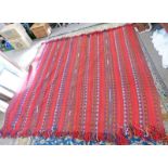 RED GROUND MIDDLE EASTERN CARPET WITH STRIPED GEOMETRIC DESIGN 245 X 225CM