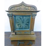 EARLY 20TH CENTURY WALNUT MANTLE CLOCK WITH CARVED DECORATION WITH SILVERED DIAL 39CM TALL