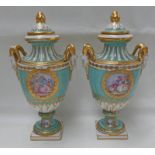 PAIR OF CONTINENTAL PORCELAIN PALE GREEN LIDDED VASES WITH TWIN GOATS MASK HANDLES ON SQUARE BASES