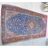 DEEP BLUE GROUND IRANIAN RUG OF KASHAN ORIGIN WITH ALL OVER FLORAL PATTERN AND CENTRAL MEDALLION