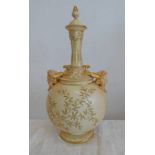 ROYAL WORCESTER VASE WITH PEACH GROUND AND MASK HANDLES.