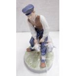 ROYAL COPENHAGEN FIGURE GROUP DEPICTING A FARMER WITH TWO SHEEP 20CM TALL