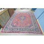 LARGE RED GROUND IRANIAN CARPET OF MARSHAD ORIGIN WITH TRADITIONAL FLORAL MEDALLION PATTERN 375 X