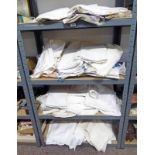 GOOD SELECTION OF LINEN TABLE CLOTHS ETC OVER 4 SHELVES