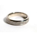 A platinum diamond eternity ring, pavé set with two bands of round brilliant cut diamonds, total