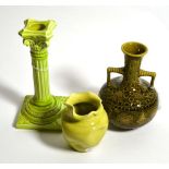 A Burmantofts Faience pottery candlestick, lime glaze, impressed factory mark and 1198, 21cm; a
