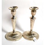 A matched pair of George III style silver candlesticks, C J Vander Ltd, Sheffield, 1996 and 2001