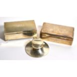 An engine turned silver cigarette box; another silver cigarette box; and a silver capstan inkwell