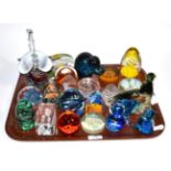 A group of paperweights including Mdina, 19th century dump weights and other examples