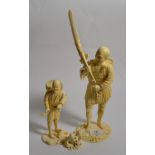 Two Japanese ivory okimono of farmers, Meiji period, both signed; together with a small ivory