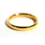 An 18 carat gold band ring, finger size L1/2, 3.5g