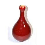 A Chinese sang-de-boeuf bottle vase, 35cm height. Modern and in generally good condition, some light