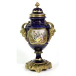 A Gilt Metal Mounted Sèvres Style Porcelain Urn Shaped Vase and Cover, with Bacchus mask handles,
