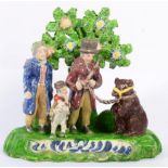 A Staffordshire Pearlware Bear Bating Group, circa 1820, as two gentlemen and a boy with a bear