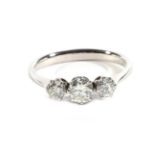 A Diamond Three Stone Ring, graduated transitional cut diamonds in claw settings, to tapered