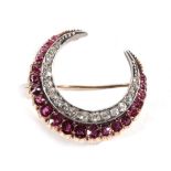A Ruby and Diamond Crescent Brooch, of graduated old cut and round cut rubies, total estimated