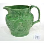 A Staffordshire Green Glazed Earthenware Jug, circa 1810, moulded with a titled bust portrait of SIR
