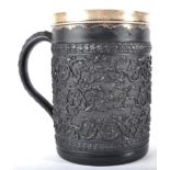 A White Metal Mounted Wedgwood Black Basalt Large Mug, circa 1800, decorated in relief with