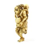 A Japanese Ivory Netsuke, Edo/Meiji period, as a Nio running carrying a child on his back, 7cm