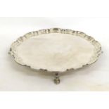 A Shaped Circular Silver Salver, Elkington & Co, Sheffield 1969, on four scroll feet, 36cm diameter,