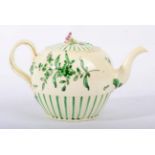 A Leeds Creamware Teapot and Cover, circa 1780, painted in green monochrome with stylised foliage
