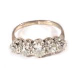 A Five Stone Diamond Ring, graduated old cut diamonds in claw settings, to knife edge shoulders,