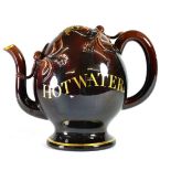 A Brameld Treacle Glazed Cadogan Teapot, circa 1830, of traditional form, inscribed in gilt HOT
