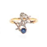 A Sapphire and Diamond Crossover Ring, a round cut sapphire and an old cut diamond to rose cut