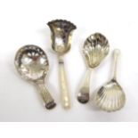 Four George III Silver Caddy Spoons, comprising: an example with mother of pearl handle, IT,