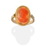 A Carved Carnelian Cameo Mounted Swivel Ring, carved in high relief depicting the bust of Bacchus,