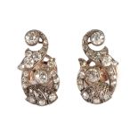 A Pair of Early Twentieth Century Diamond Earrings, as scrolls of grain set old cut diamonds,