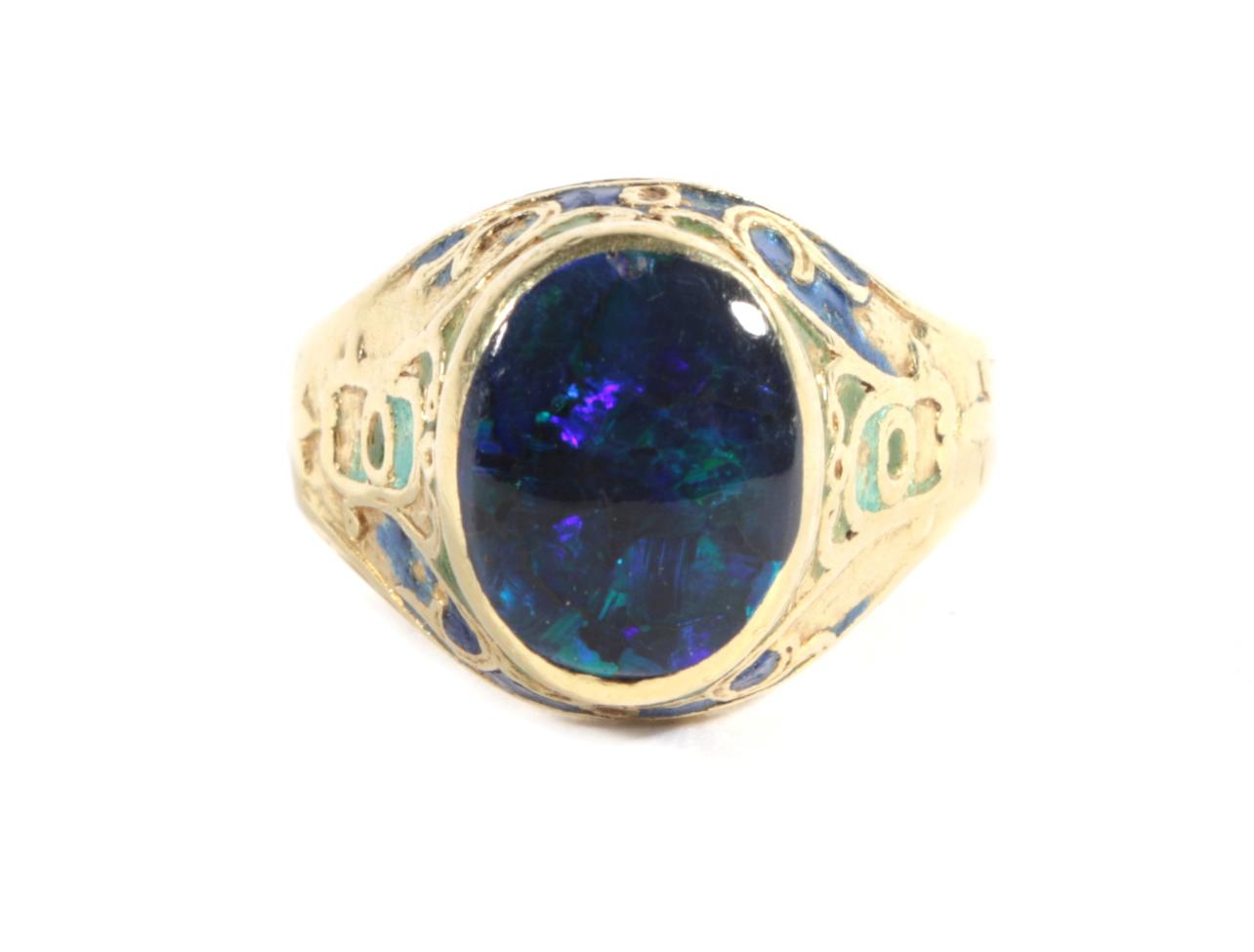 An Arts & Crafts Black Opal and Enamel Signet Ring, an oval black opal in a rubbed over setting,
