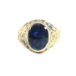 An Arts & Crafts Black Opal and Enamel Signet Ring, an oval black opal in a rubbed over setting,