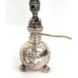 A Chinese Export Silver Oil Lamp, apparently unmarked, circa 1900, spherical form on three melon