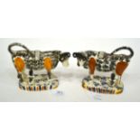 A Matched Pair of Pearlware Cow Creamers, circa 1820, with black and ochre sponged markings, each