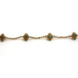 A Victorian Turquoise Bracelet, of turquoise set cannetille beads, spaced by chains, length 8cm .