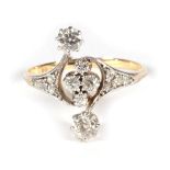 An Early Twentieth Century Diamond Ring, a cluster of four old cut diamonds spaced by two larger old