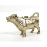 A German Silver Cow Creamer, no makers mark, stamped 925, of semi naturalistic form, with hinged