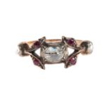 A Rose Cut Diamond and Ruby Ring, an oval rose cut diamond in a closed-backed collet setting,