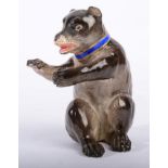 A Meissen Porcelain Model of a Seated Bear, 19th century, after the model by J J Kaendler, wearing a