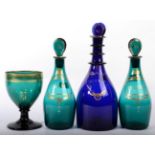 A Pair of Green Glass Spirit Decanters and Stoppers, circa 1800, of mallet form, inscribed in gilt