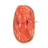 A Coral Cameo Brooch, Carved in High Relief Depicting the Bust of Diana, measures 4.2cm by 2.3cm .