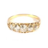 An Old Cut Diamond Five Stone Ring, graduated old cut diamonds in a carved setting, total