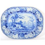 A Staffordshire Pearlware Meat Platter, circa 1820, printed in underglaze blue with a cowherd,