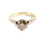 An Old Cut Solitaire Diamond Ring, a brown-coloured old cut diamond in a claw setting, to tapered