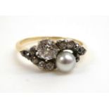 A Late Nineteenth Century Pearl and Diamond Crossover Ring, a single pearl and an old cut diamond to