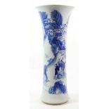 A Chinese Porcelain Beaker Vase, in Kangxi style, painted in underglaze blue with figures on a river