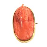 A Coral Cameo Brooch, Carved in High Relief Depicting the Bust of Diana, measures 4.2cm by 2.3cm .